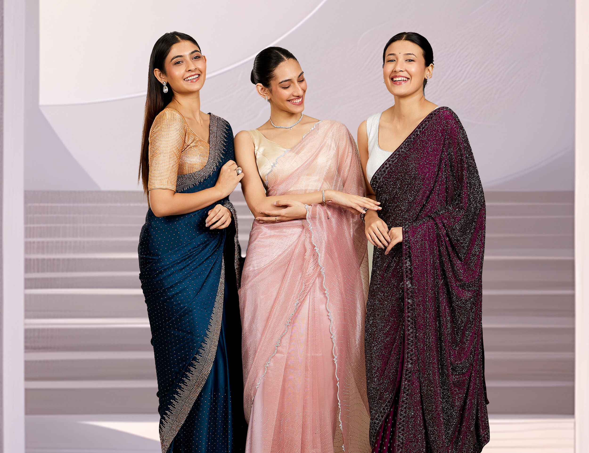 Graceful women showcasing traditional blue, pink, and purple sarees, styled beautifully for different events